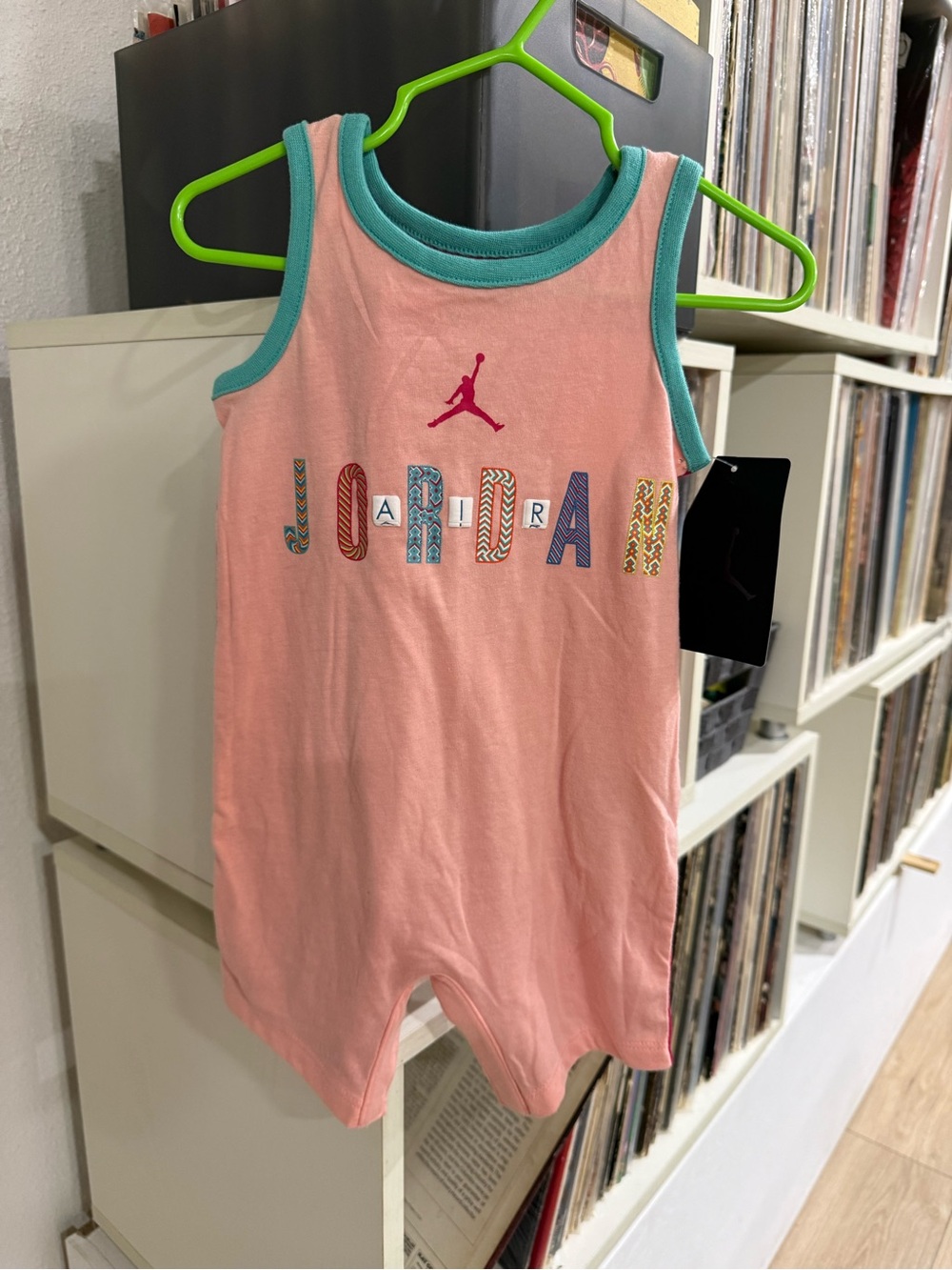 Jordan Kids Pink Romper with Teal Trim and Multicolor Logo